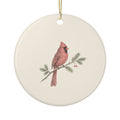 Personalized cardinal memorial ornament, front: a hand-drawn red cardinal on a pine branch with berries