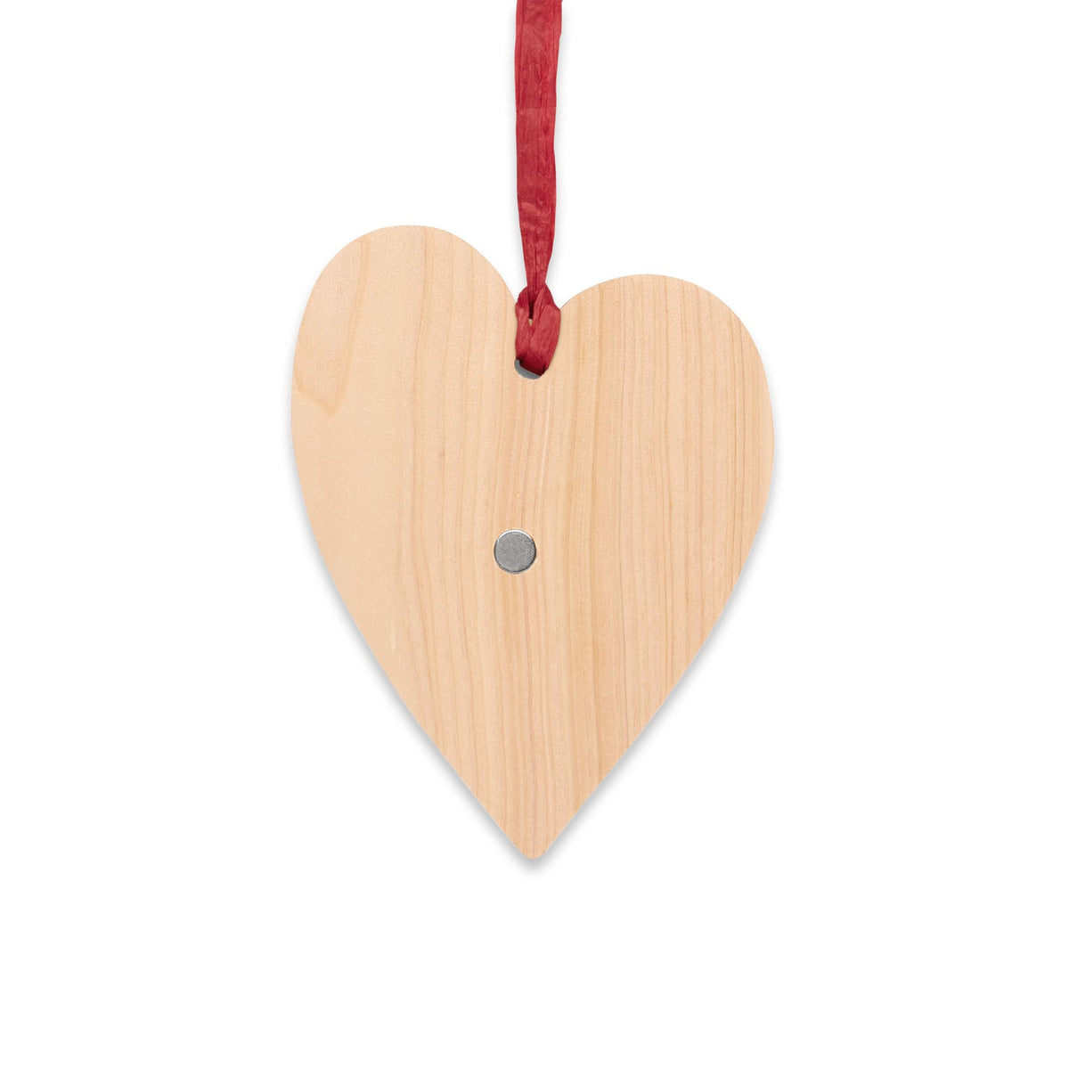 Back of the wooden heart ornament showing the natural wood and the small magnet