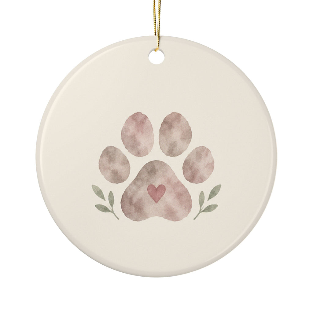 Personalized paw print pet memorial ornament, front: a hand-painted paw print with a small heart