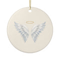 Personalized angel wings memorial ornament, front: hand-painted angel wings with a small gold halo