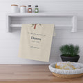 Personalized cardinal memorial tea towel for Donna draped over a kitchen shelf next to a basket of bread