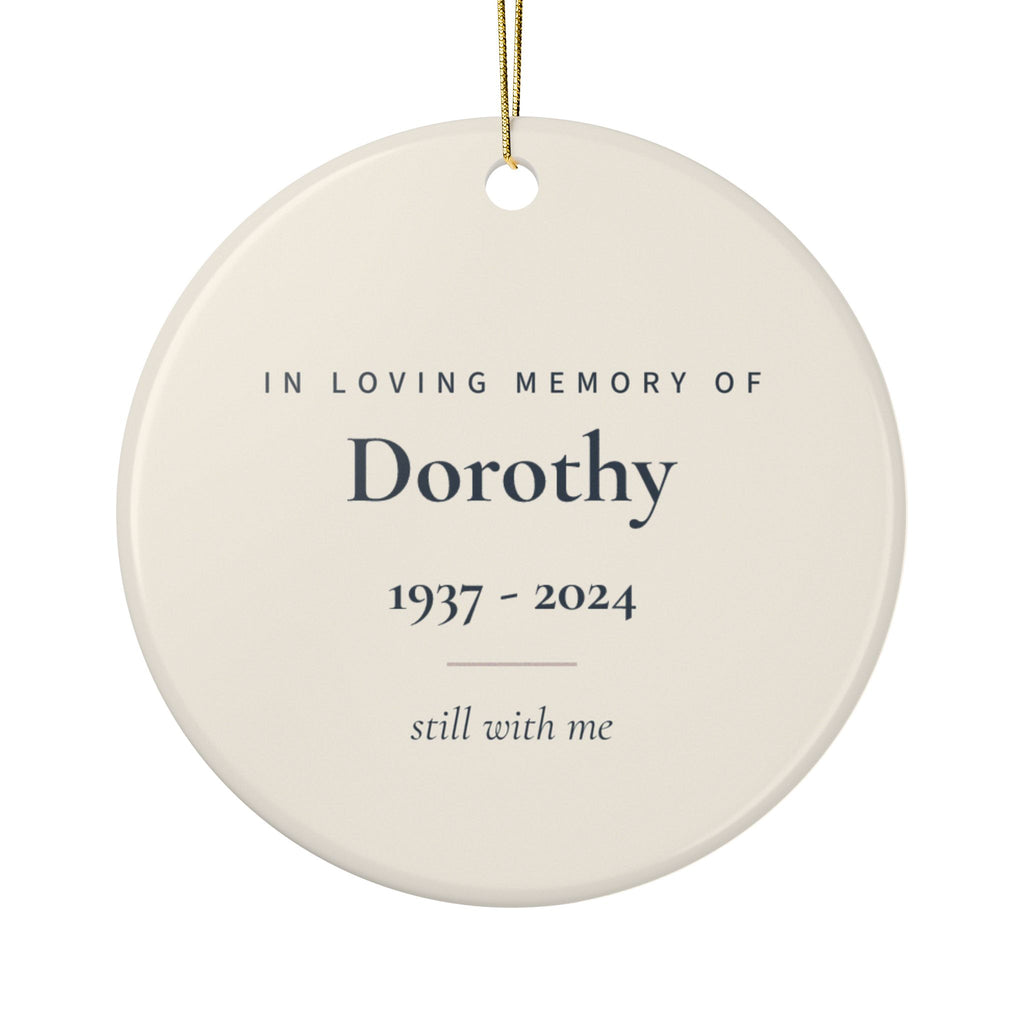 Back of the angel wings memorial ornament: In Loving Memory Of, the name Dorothy, 1937 - 2024 and the words still with me