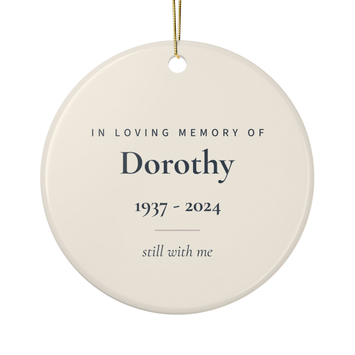 Back of the angel wings memorial ornament: In Loving Memory Of, the name Dorothy, 1937 - 2024 and the words still with me