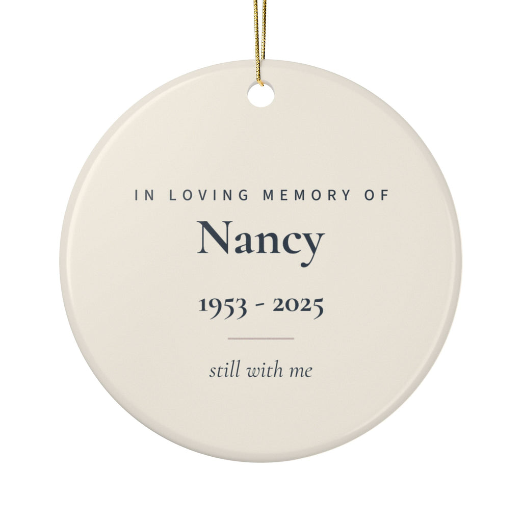 Back of the butterfly memorial ornament: In Loving Memory Of, the name Nancy, 1953 - 2025 and the words still with me