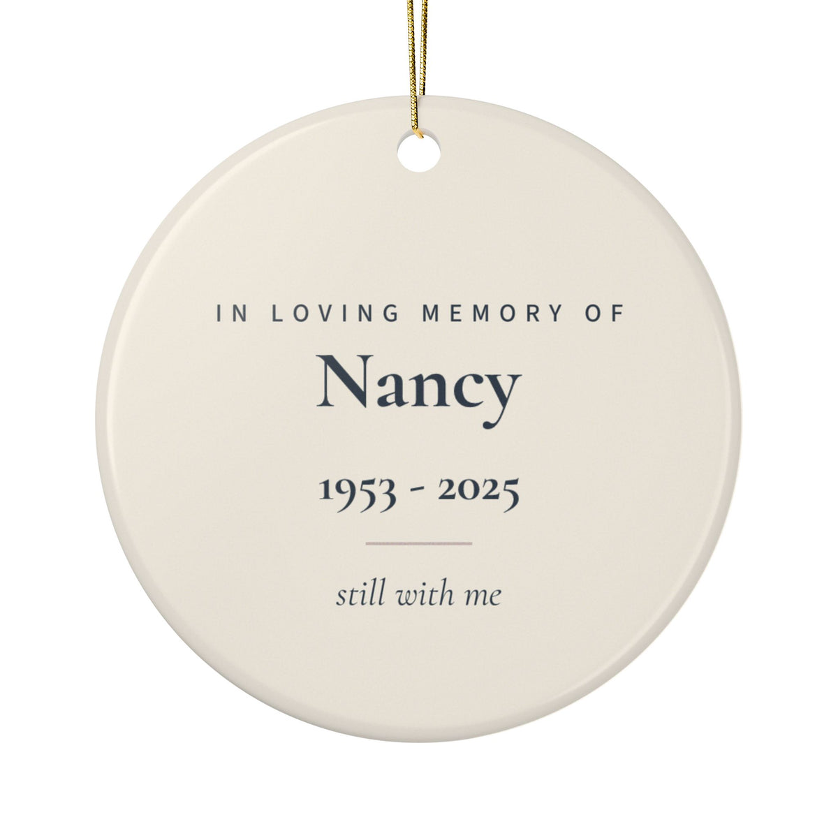 Back of the butterfly memorial ornament: In Loving Memory Of, the name Nancy, 1953 - 2025 and the words still with me