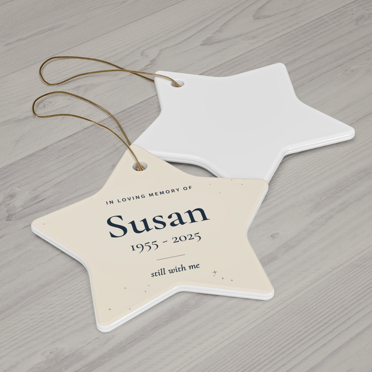 Cream ceramic star memorial ornament for Susan with gold string, printed front and white back