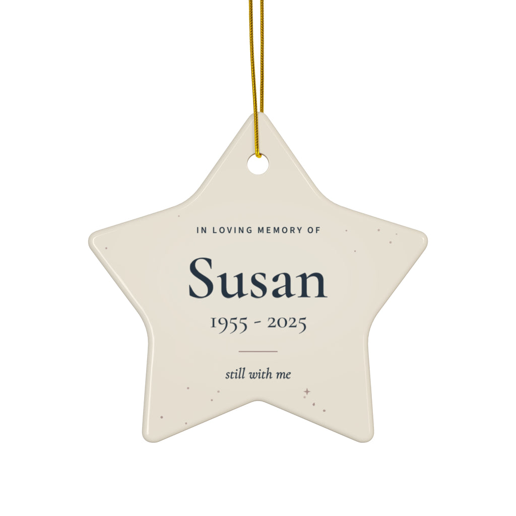 Personalized star memorial ornament in cream with the name Susan and 1955 - 2025 in navy