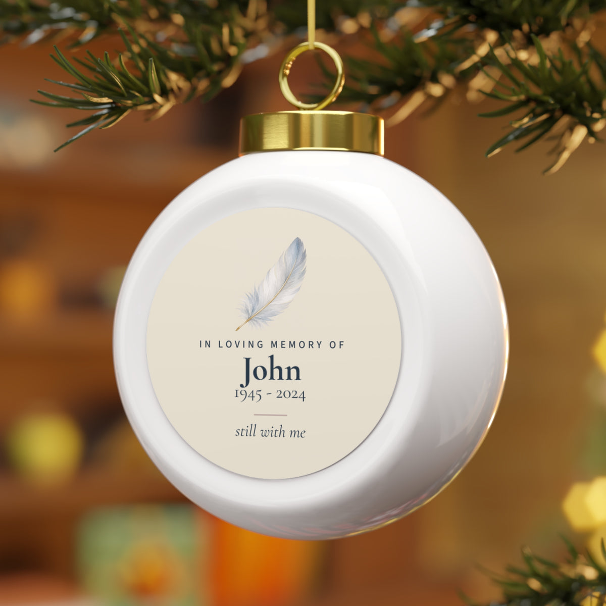 Personalized feather Christmas ball ornament on the tree, in loving memory of John