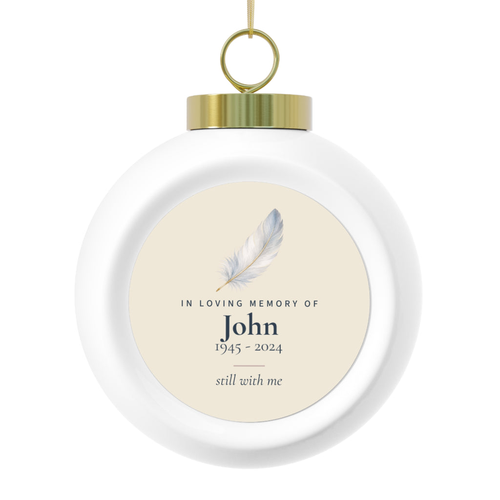 Personalized feather memorial Christmas ball, front: a hand-painted feather, In Loving Memory Of, the name John, 1945 - 2024 and still with me