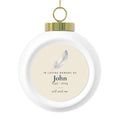 Personalized feather memorial Christmas ball, front: a hand-painted feather, In Loving Memory Of, the name John, 1945 - 2024 and still with me