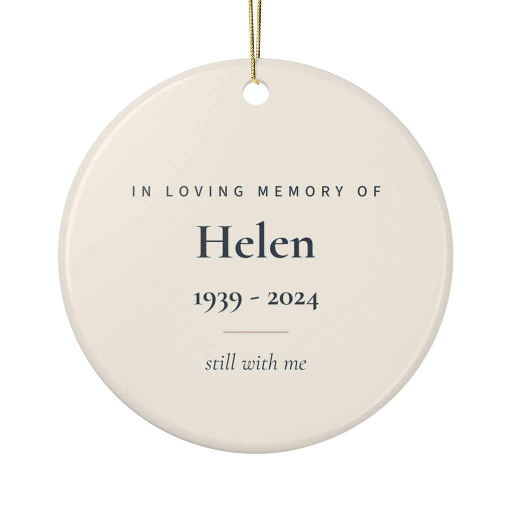 Back of the feather memorial ornament: In Loving Memory Of, the name Helen, 1939 - 2024 and the words still with me