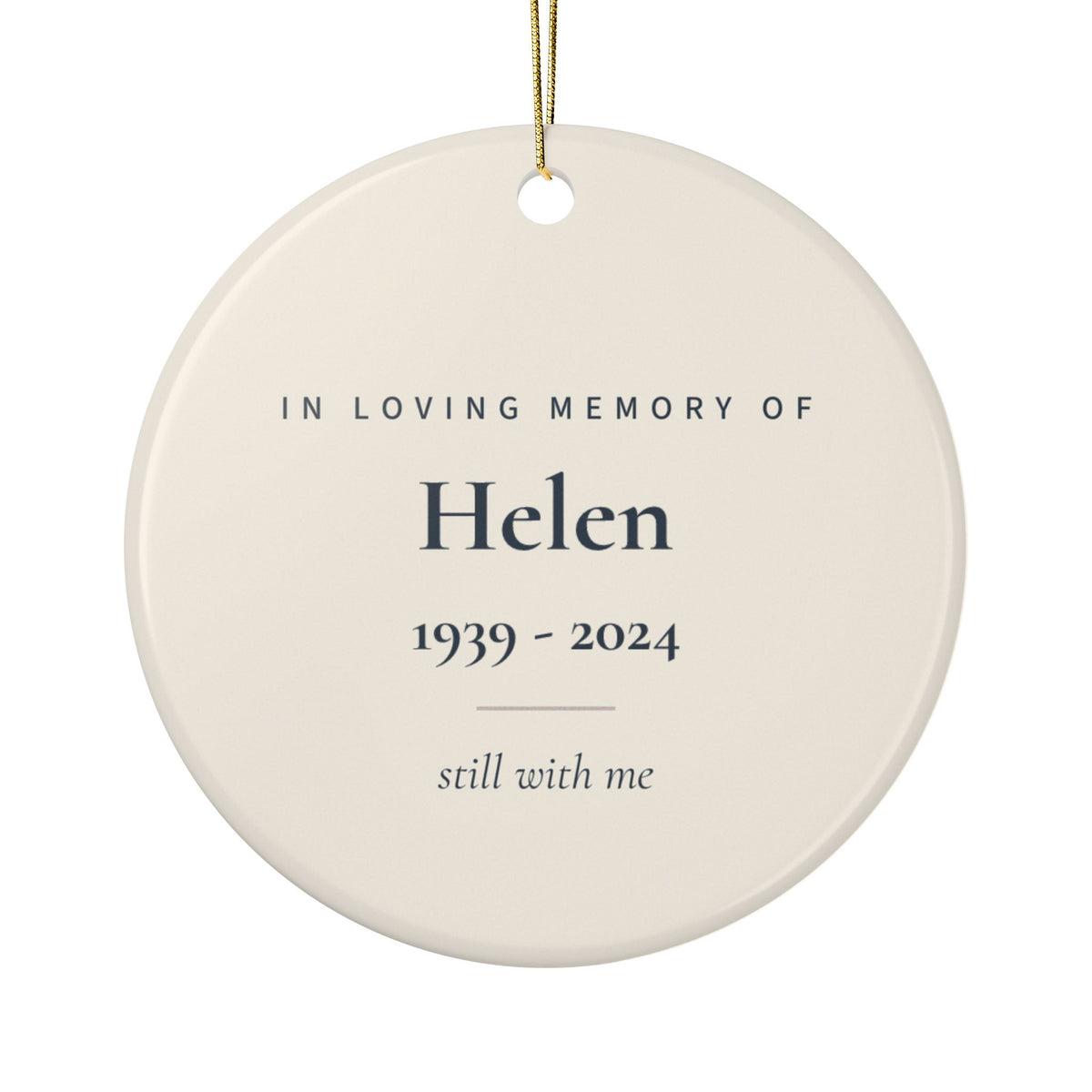 Back of the feather memorial ornament: In Loving Memory Of, the name Helen, 1939 - 2024 and the words still with me