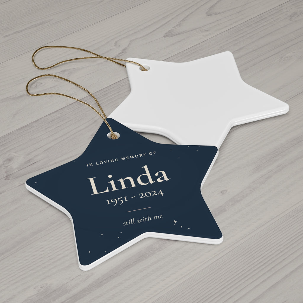 Navy ceramic star memorial ornament for Linda with gold string, printed front and white back