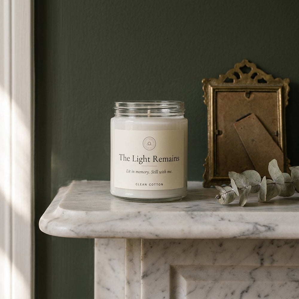 The candle on a mantel with photographs