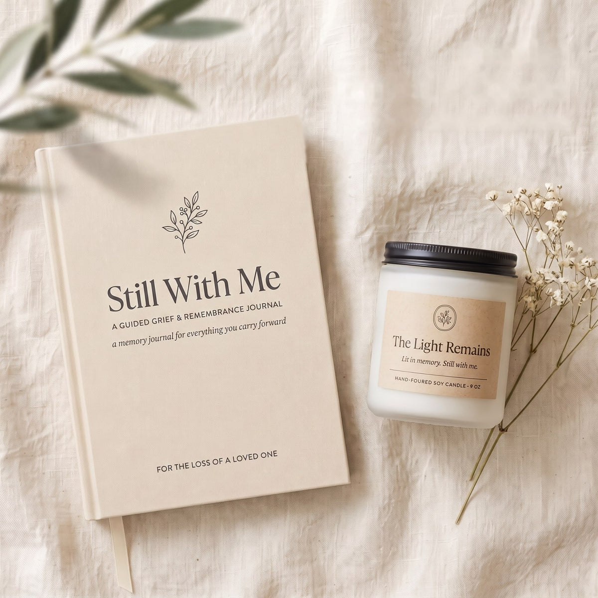 Still With Me gift set — Loved One edition journal and The Light Remains candle together on linen
